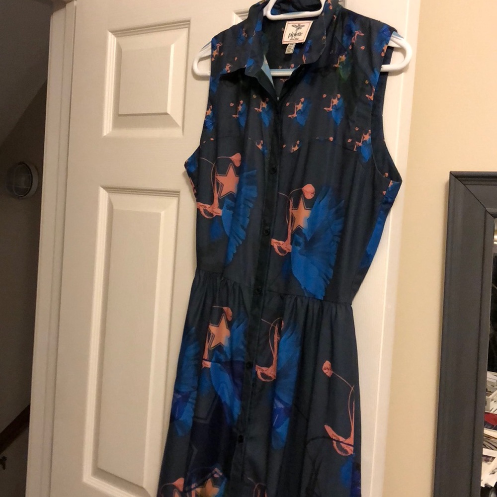Black sleeveless dress with pattern.
